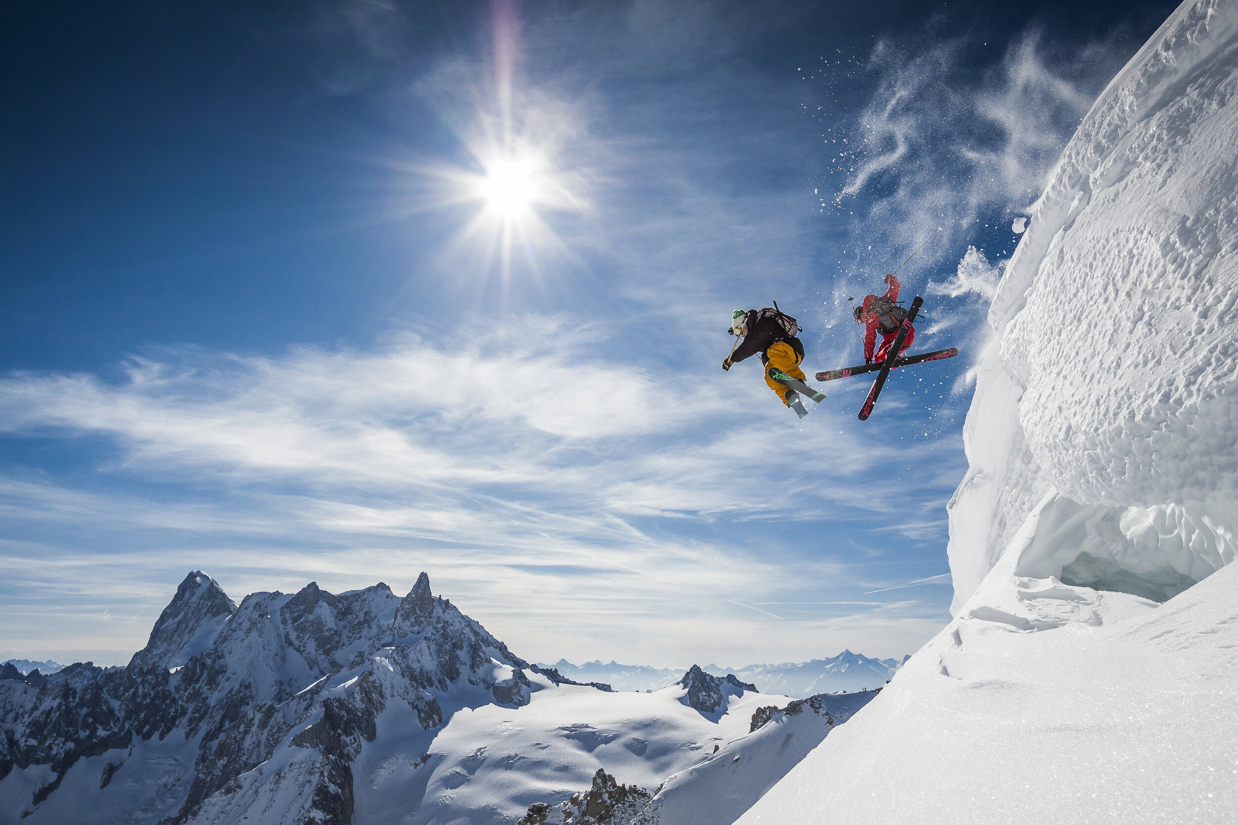 Skiers Jumping Mountains